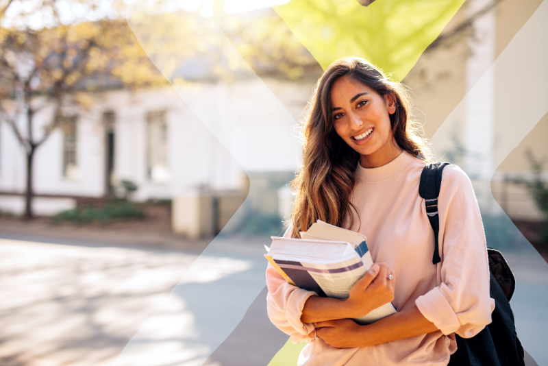 student holding books